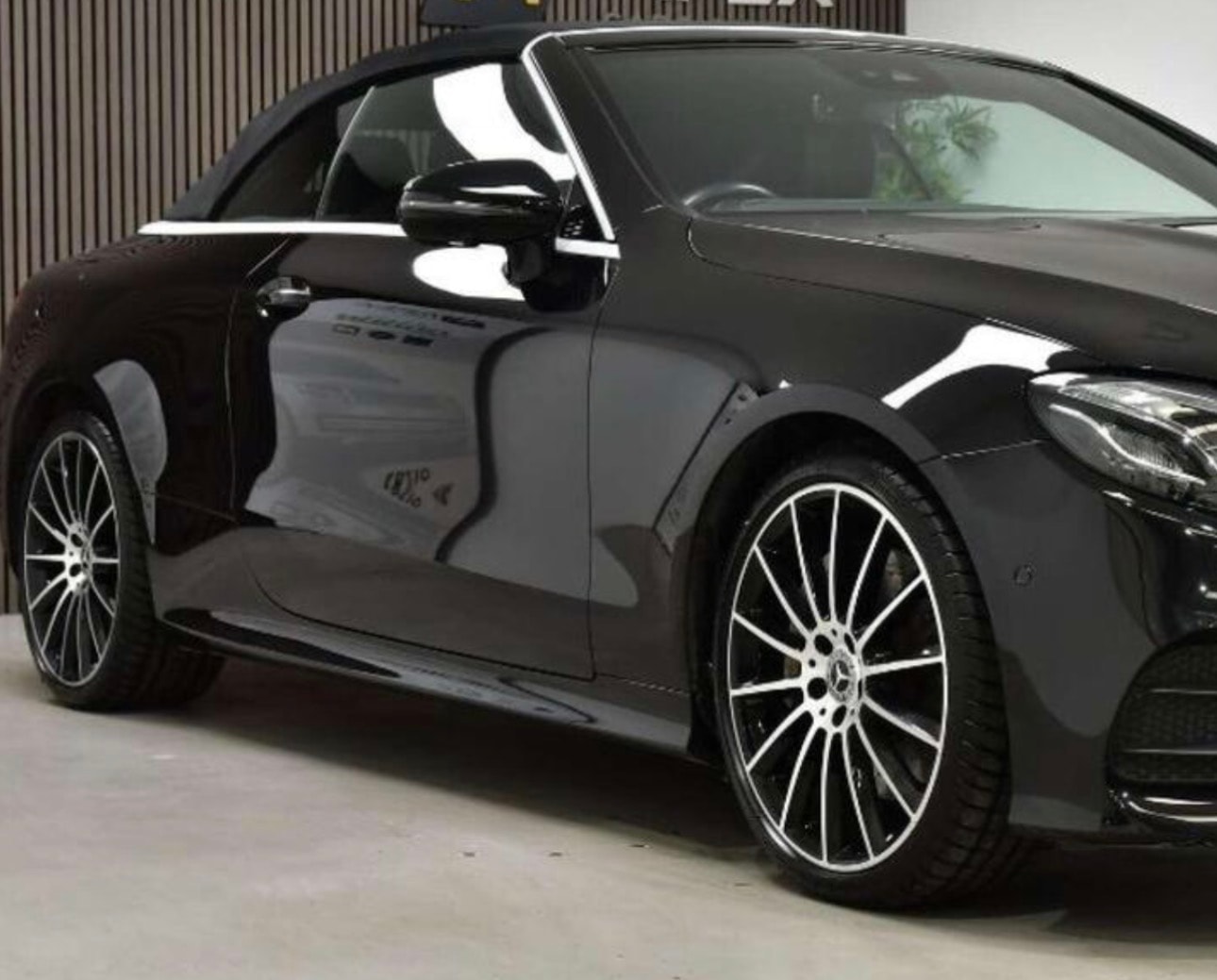 Black Mercedes-Benz E-Class convertible shown from the side